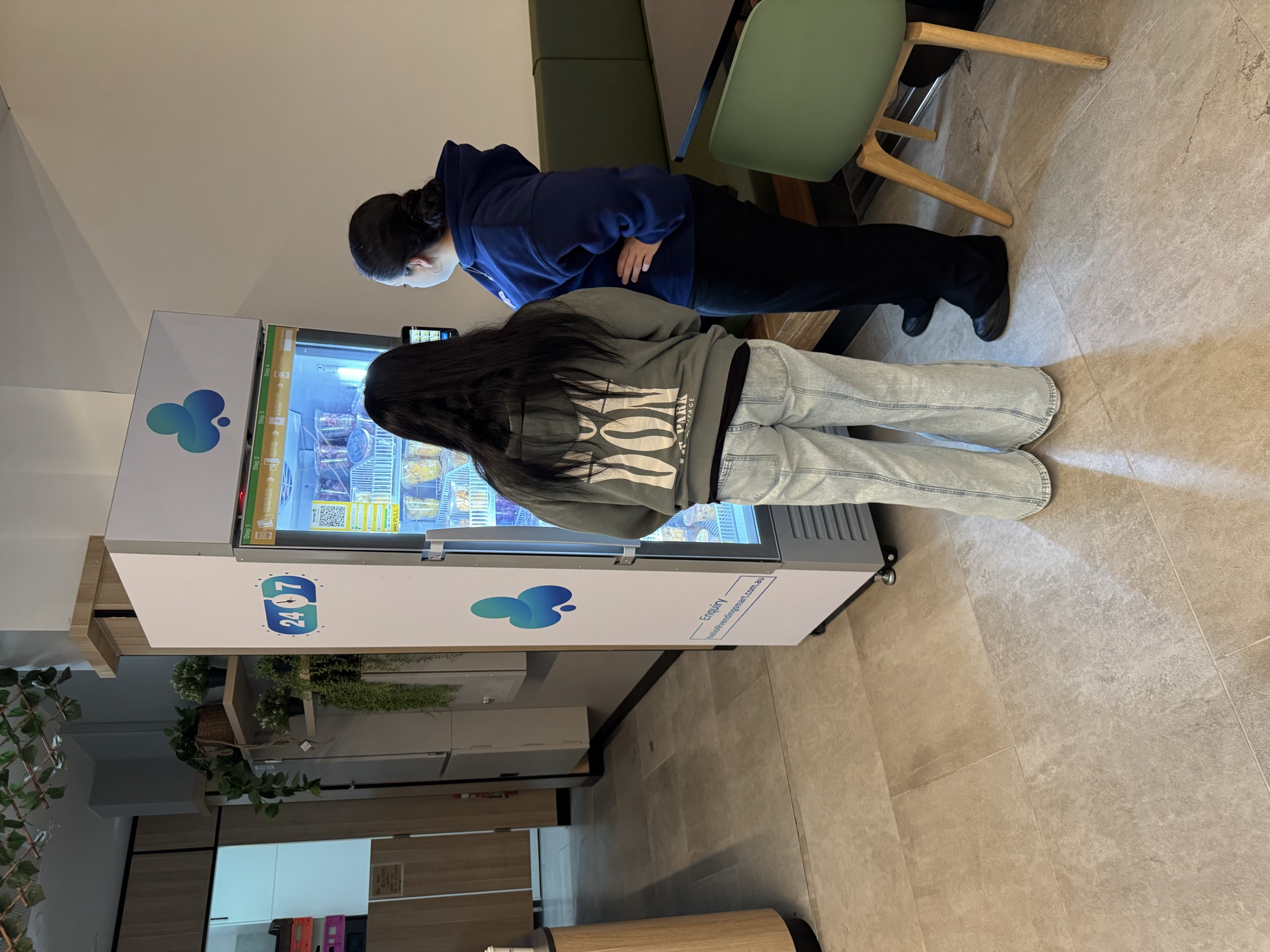 Customer using a smart vending cabinet inside a live venue
